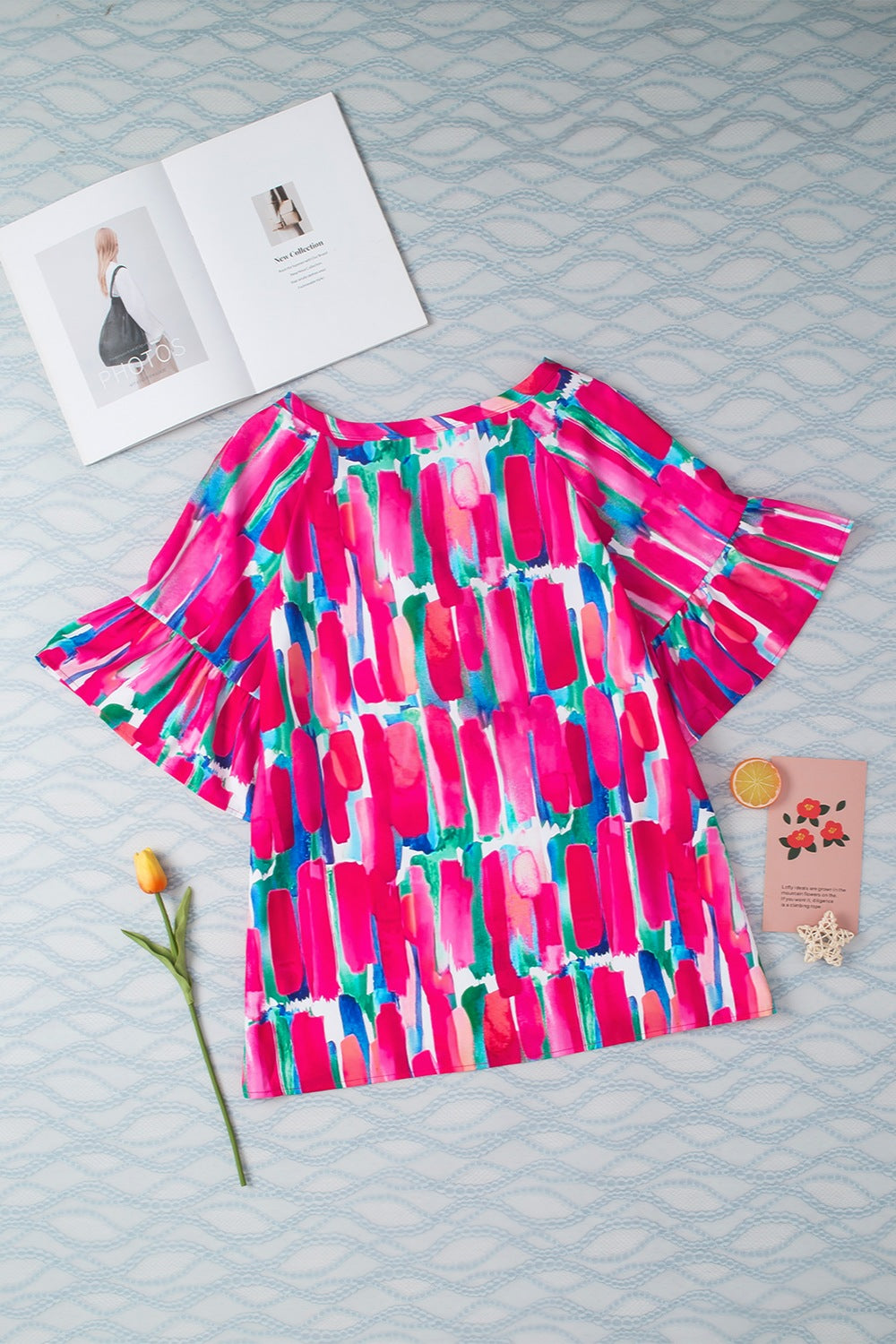 Printed Notched Half Sleeve Blouse.