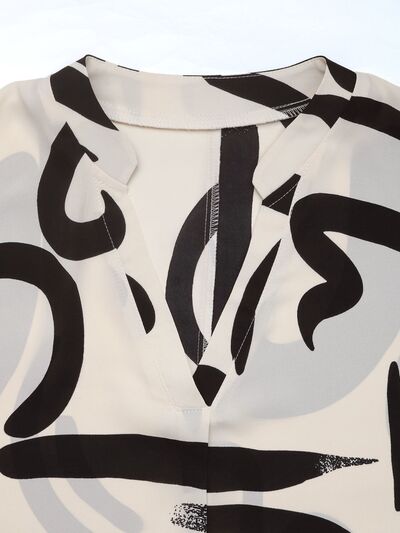 Perfee Printed Notched Half Sleeve Blouse.