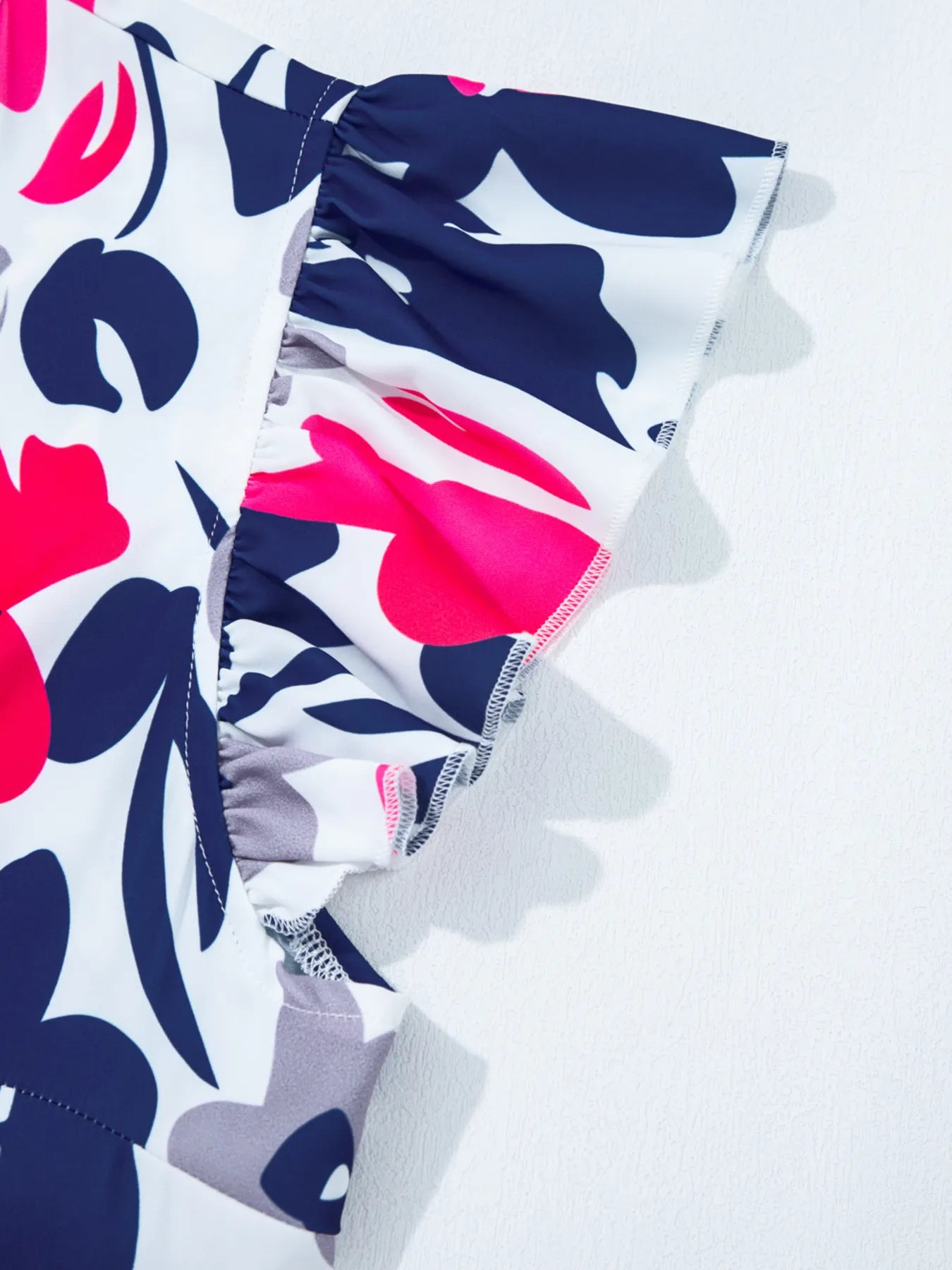 Printed Notched Neck Flutter Sleeve Mini Dress.