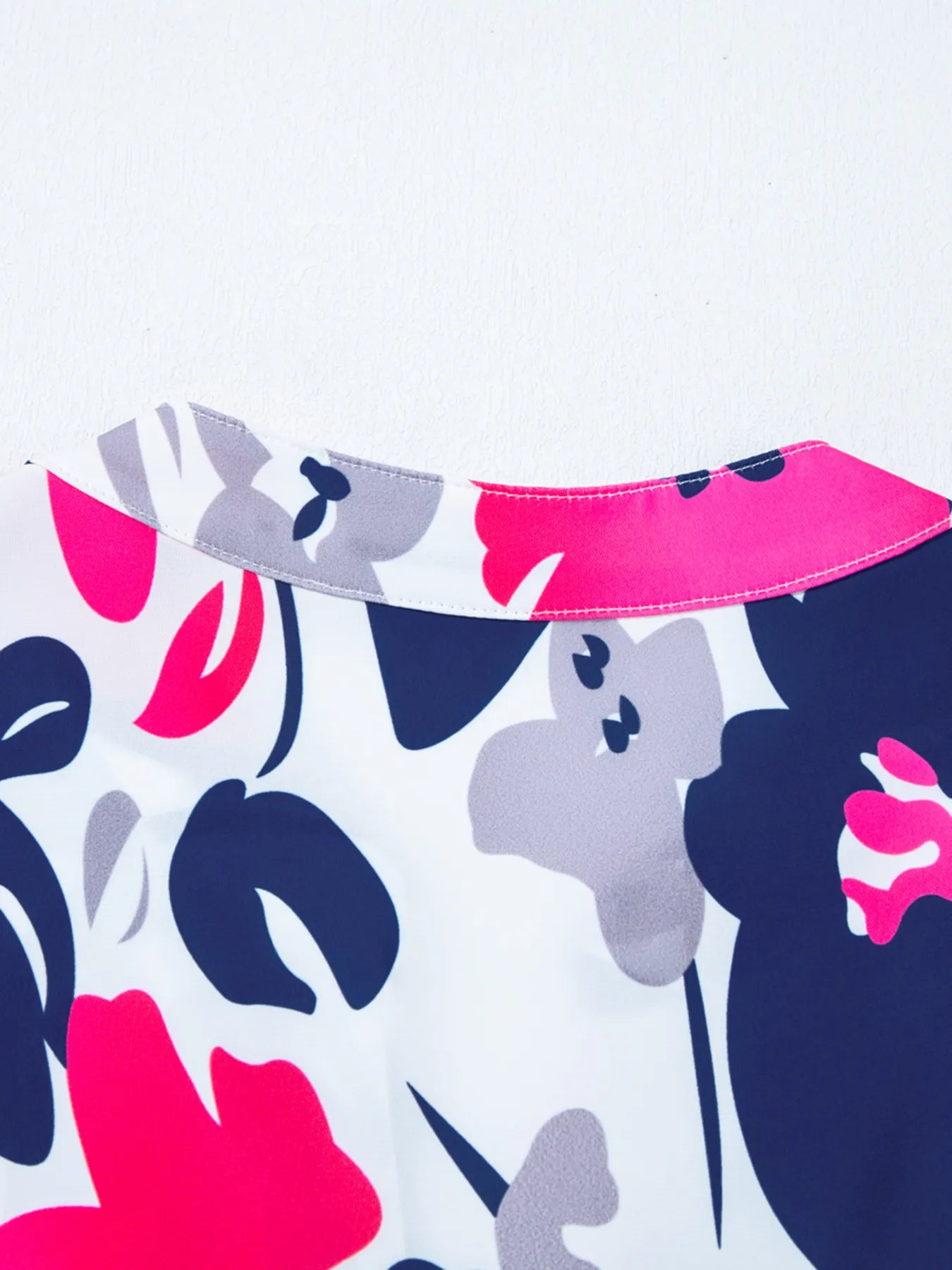 Printed Notched Neck Flutter Sleeve Mini Dress.
