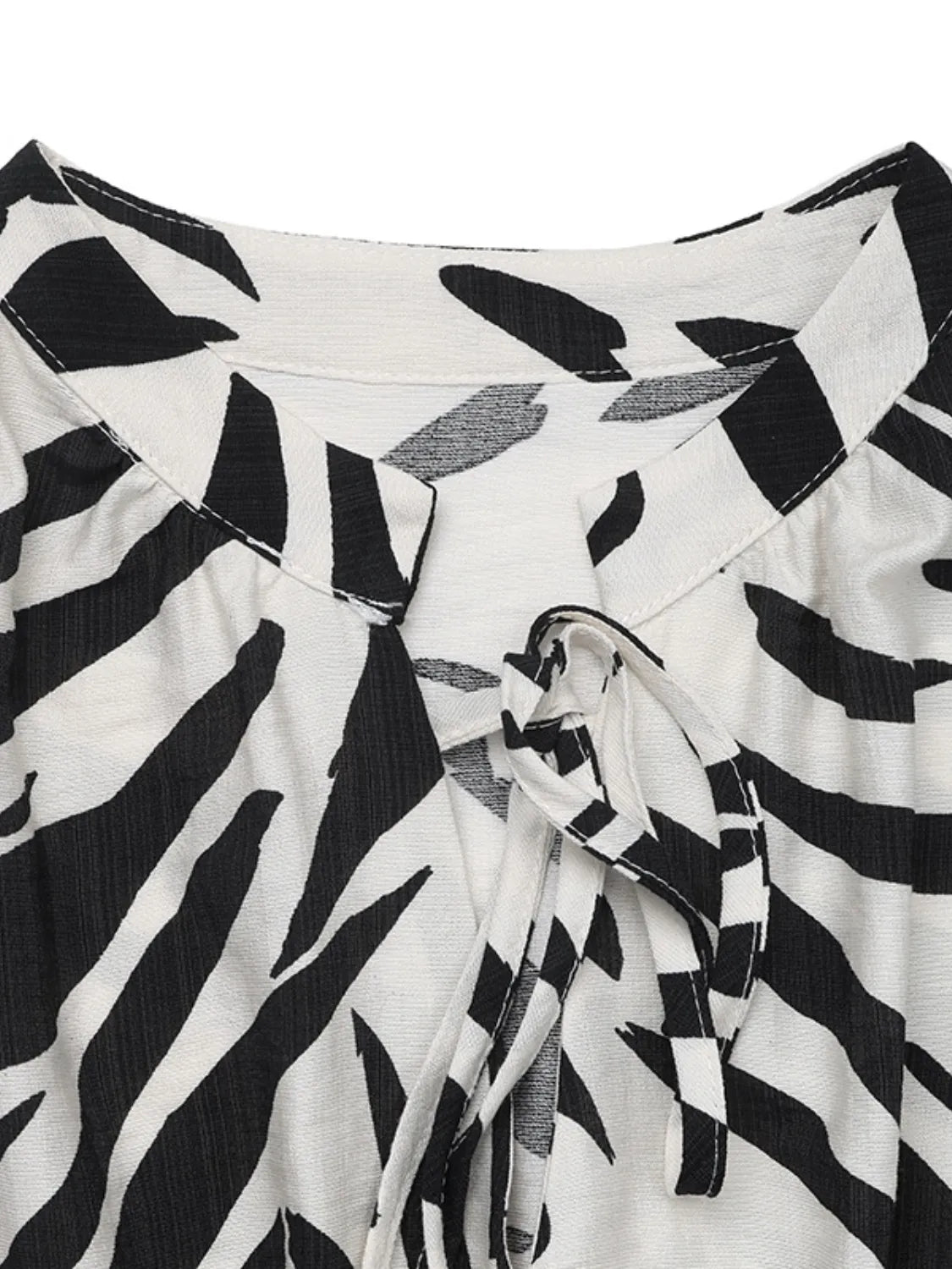 Printed Notched Sleeveless Midi Dress.