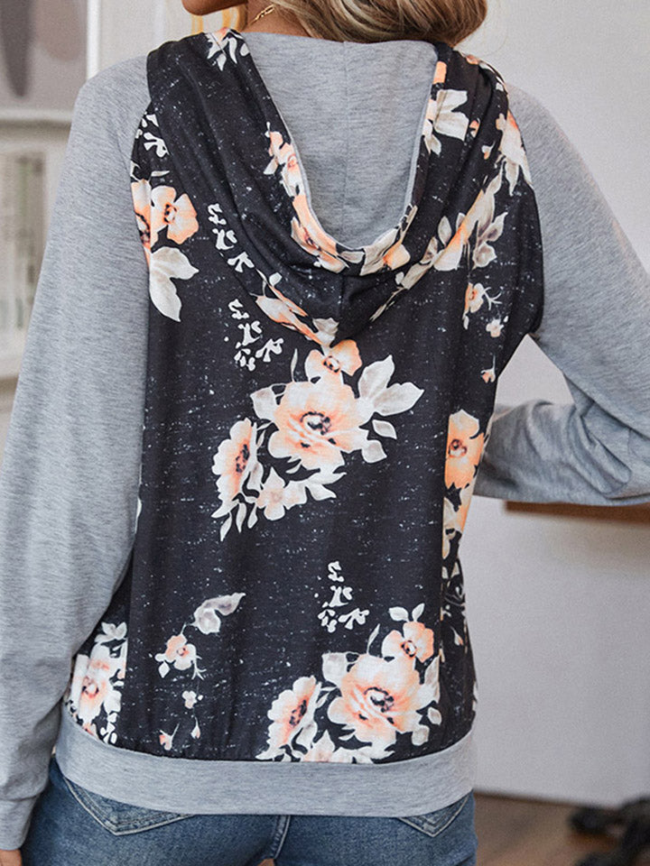 Floral printed raglan sleeve hoodie with drawstring and pockets.