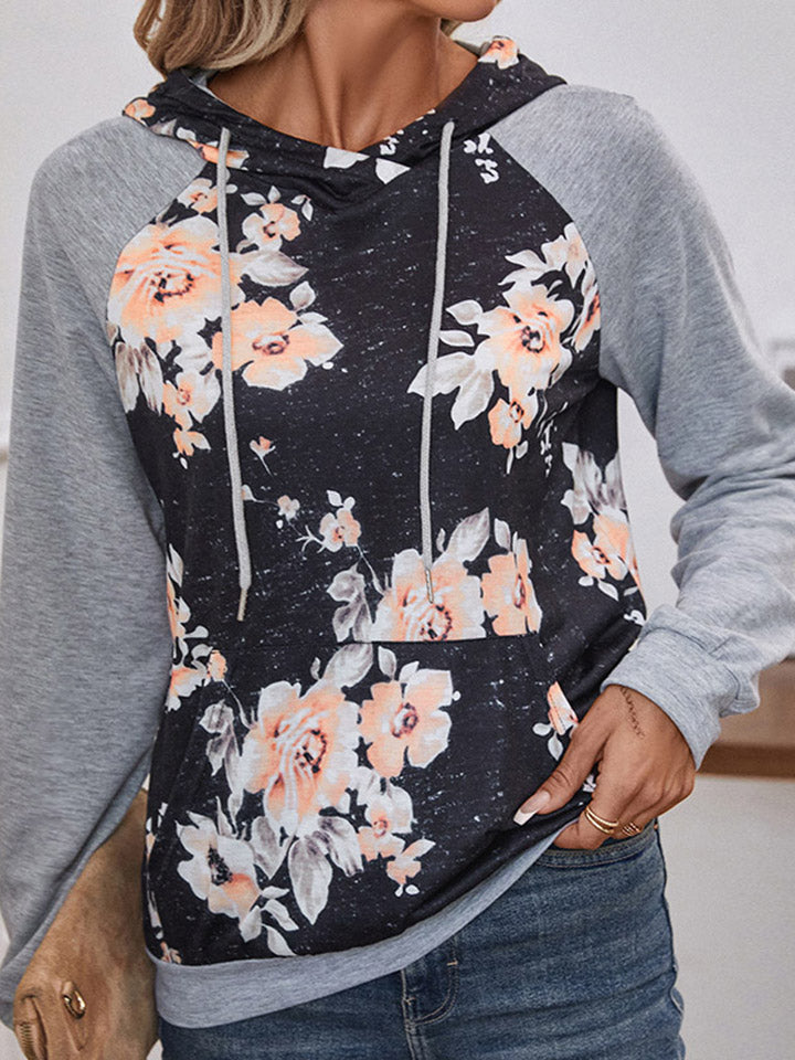 Floral printed raglan sleeve hoodie with drawstring and pockets.