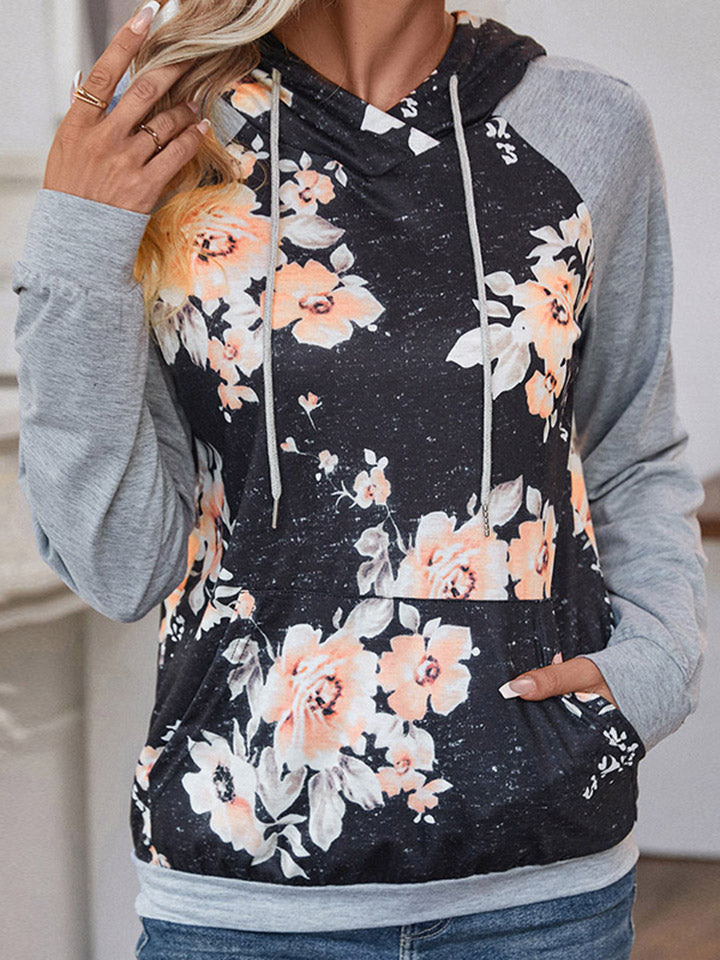 Floral printed raglan sleeve hoodie with drawstring and pockets.