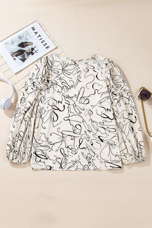 Printed Round Neck Three-Quarter Sleeve Blouse.