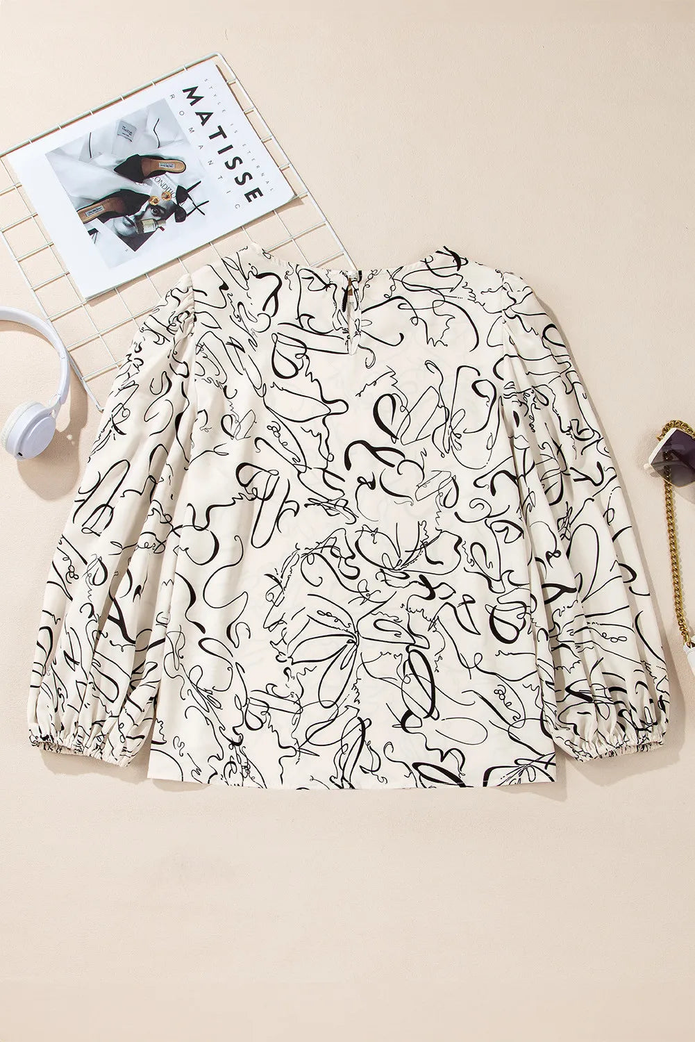 Printed Round Neck Three-Quarter Sleeve Blouse.