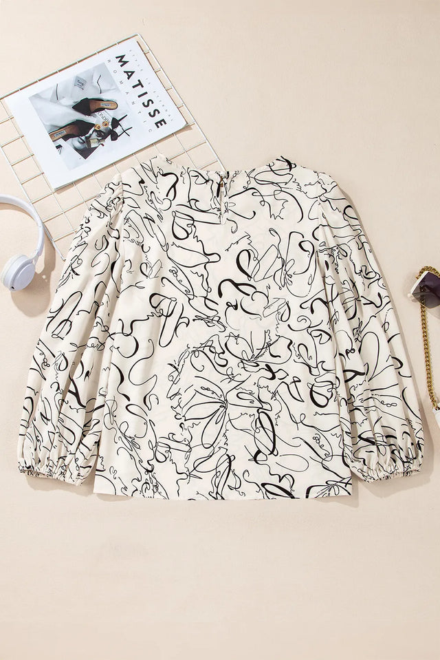 Printed Round Neck Three-Quarter Sleeve Blouse.
