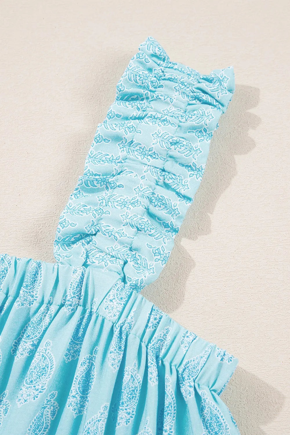 Printed ruffled wide straps tank top with tiered frill.