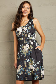 Double Take Printed Scoop Neck Sleeveless Buttoned Magic Dress with Pockets.