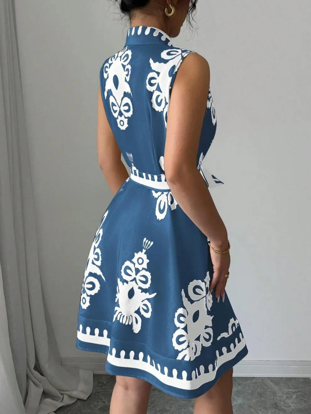Printed Sleeveless Button Front Dress.