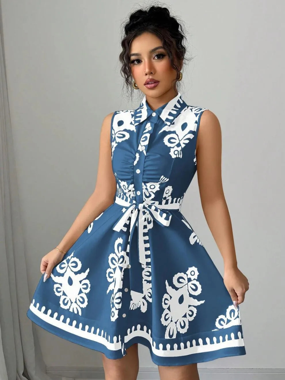 Printed Sleeveless Button Front Dress.