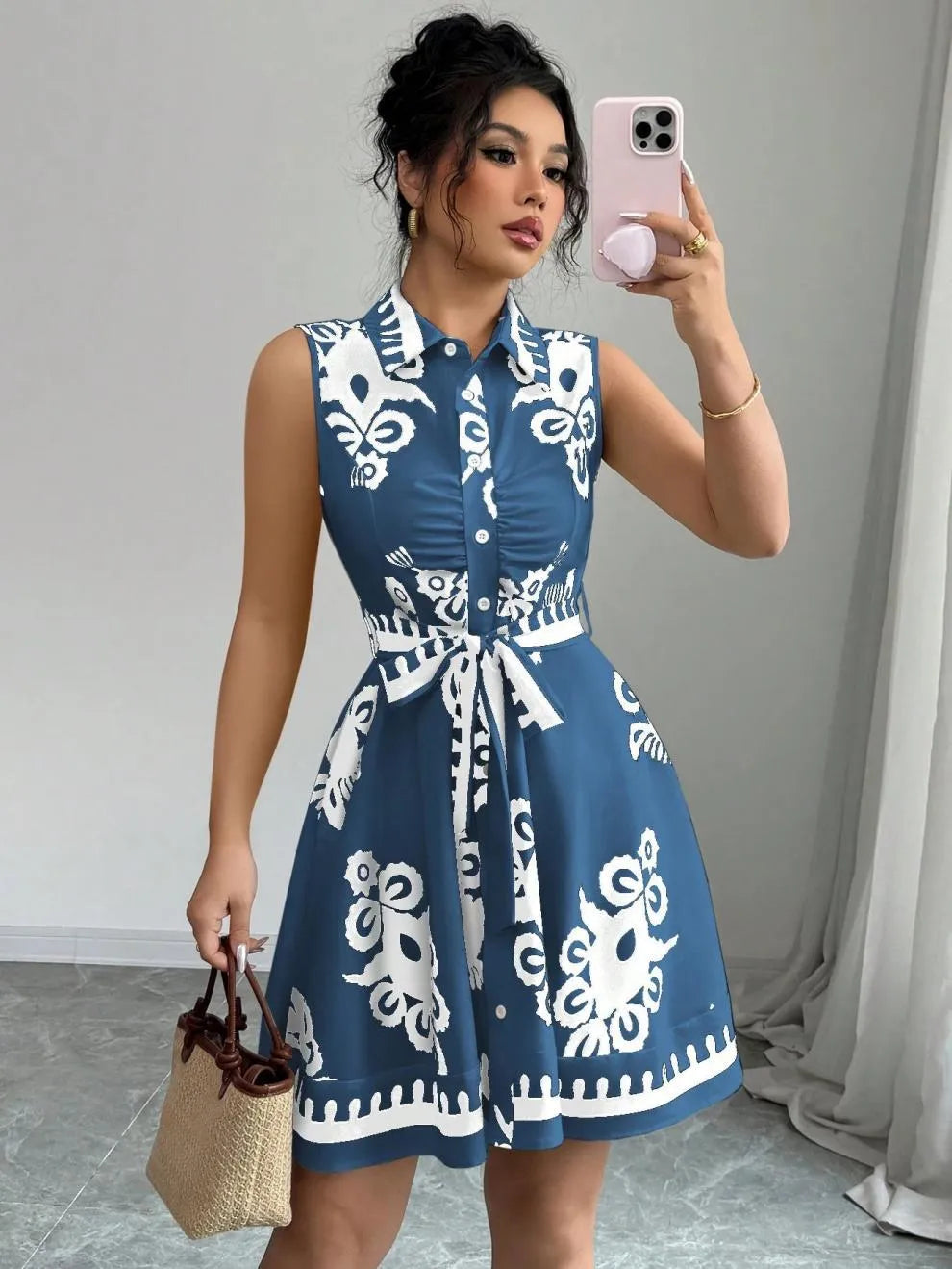 Printed Sleeveless Button Front Dress.