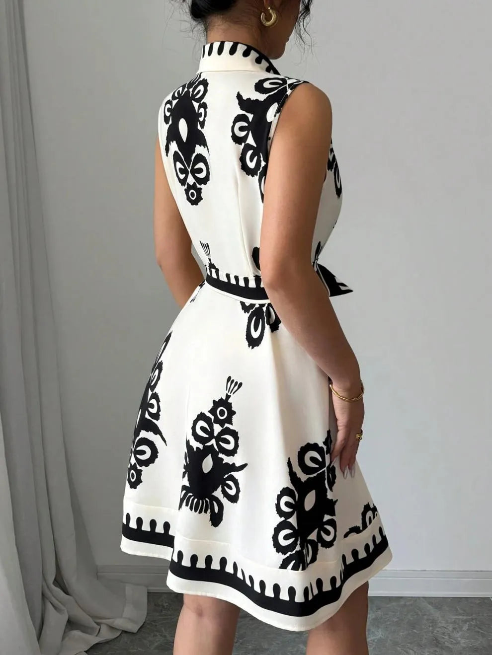 Printed Sleeveless Button Front Dress.