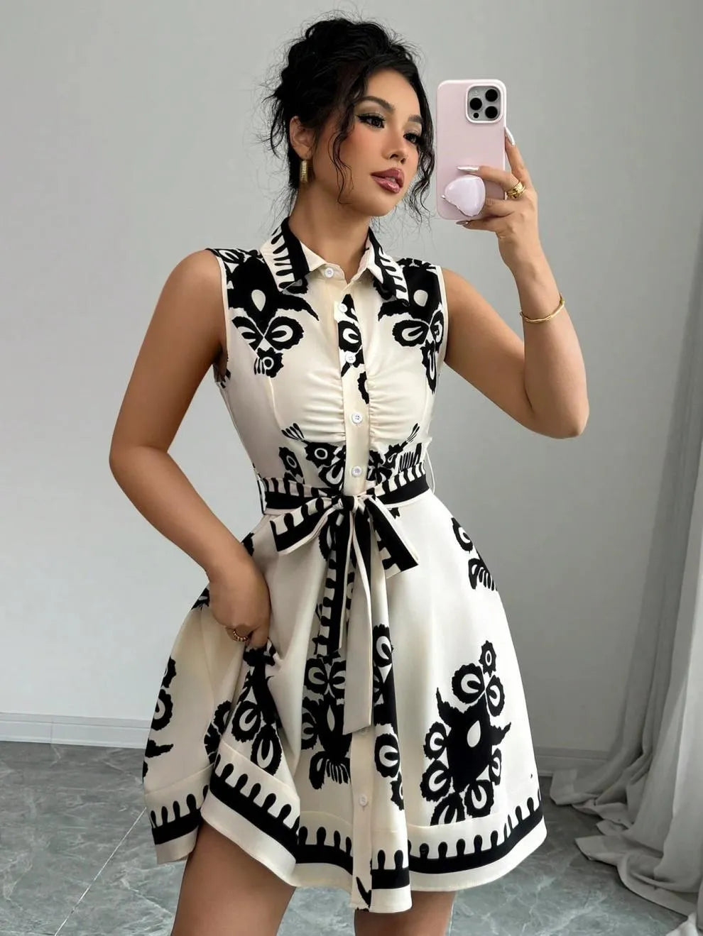 Printed Sleeveless Button Front Dress.