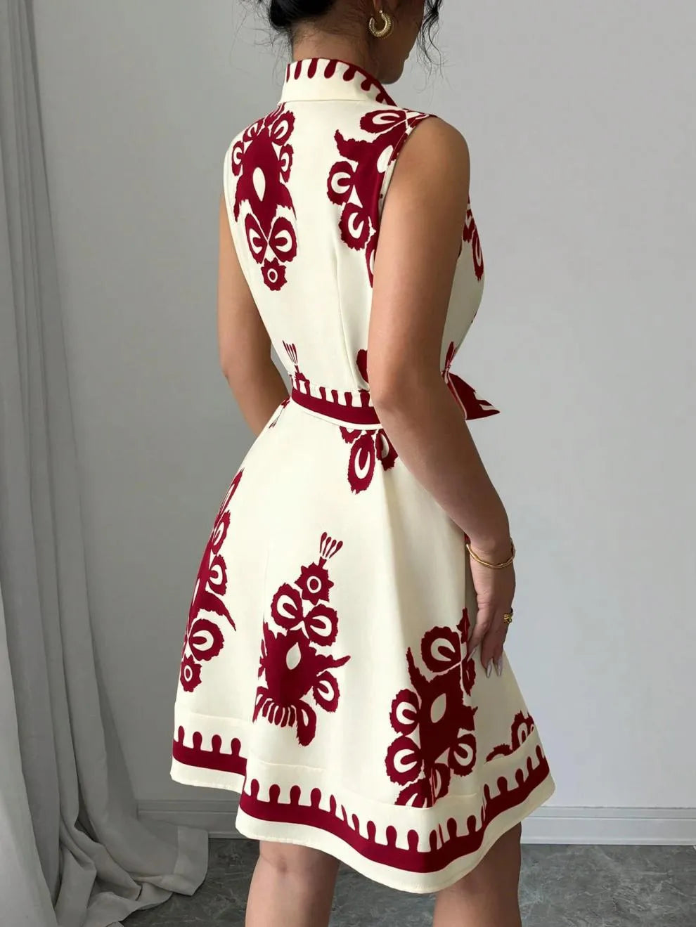 Printed Sleeveless Button Front Dress.