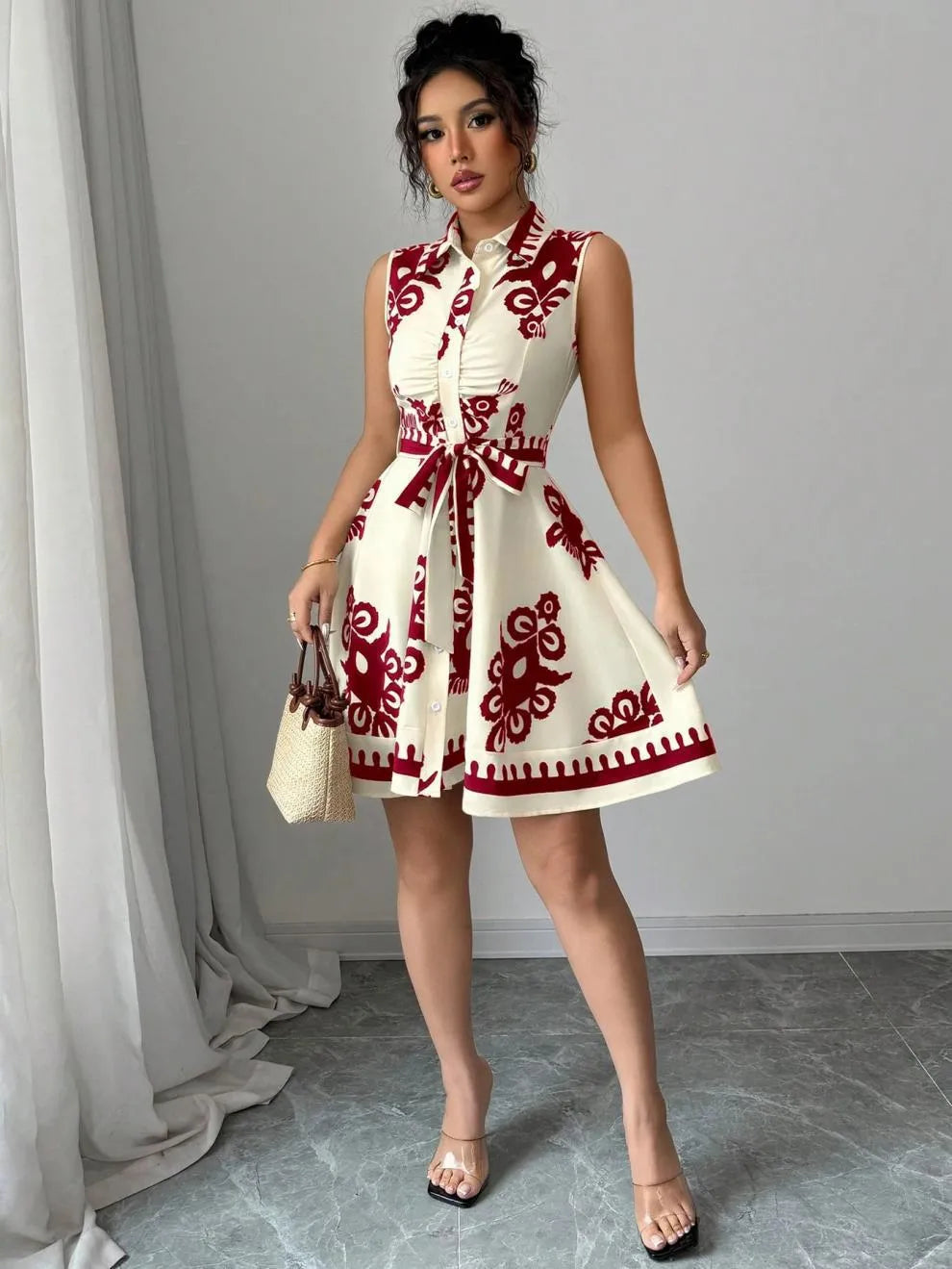 Printed Sleeveless Button Front Dress.