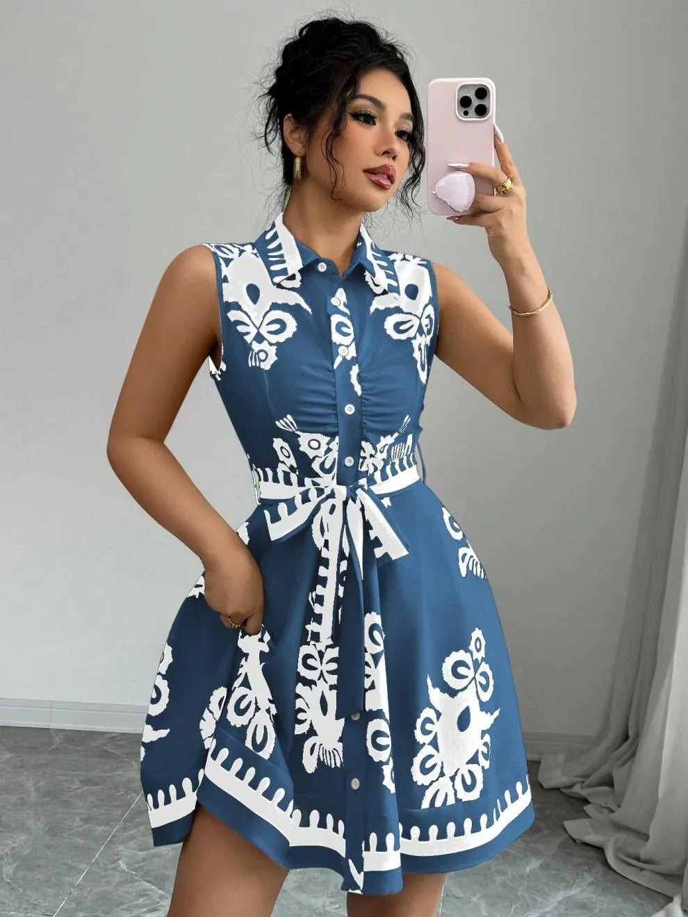 Printed Sleeveless Button Front Dress.