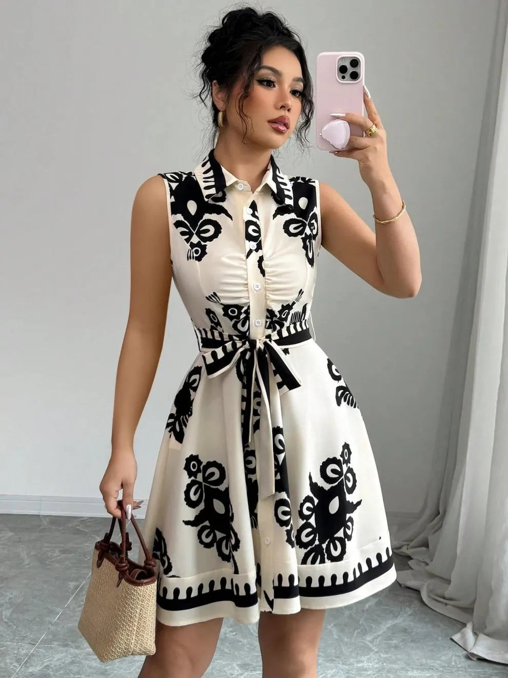 Printed Sleeveless Button Front Dress.