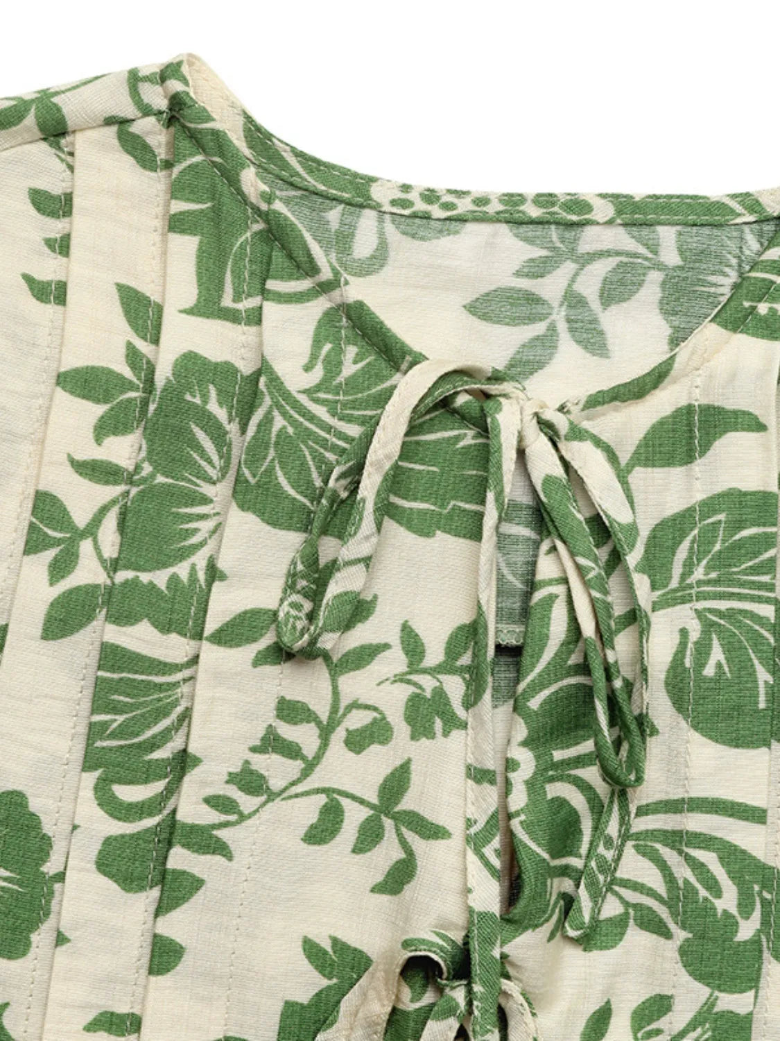 Printed Sleeveless Ruffle Peplum Blouse.