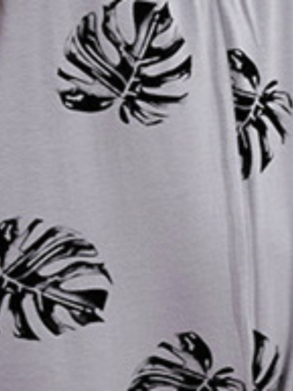 Printed Spaghetti Strap Jumpsuit with Pockets.