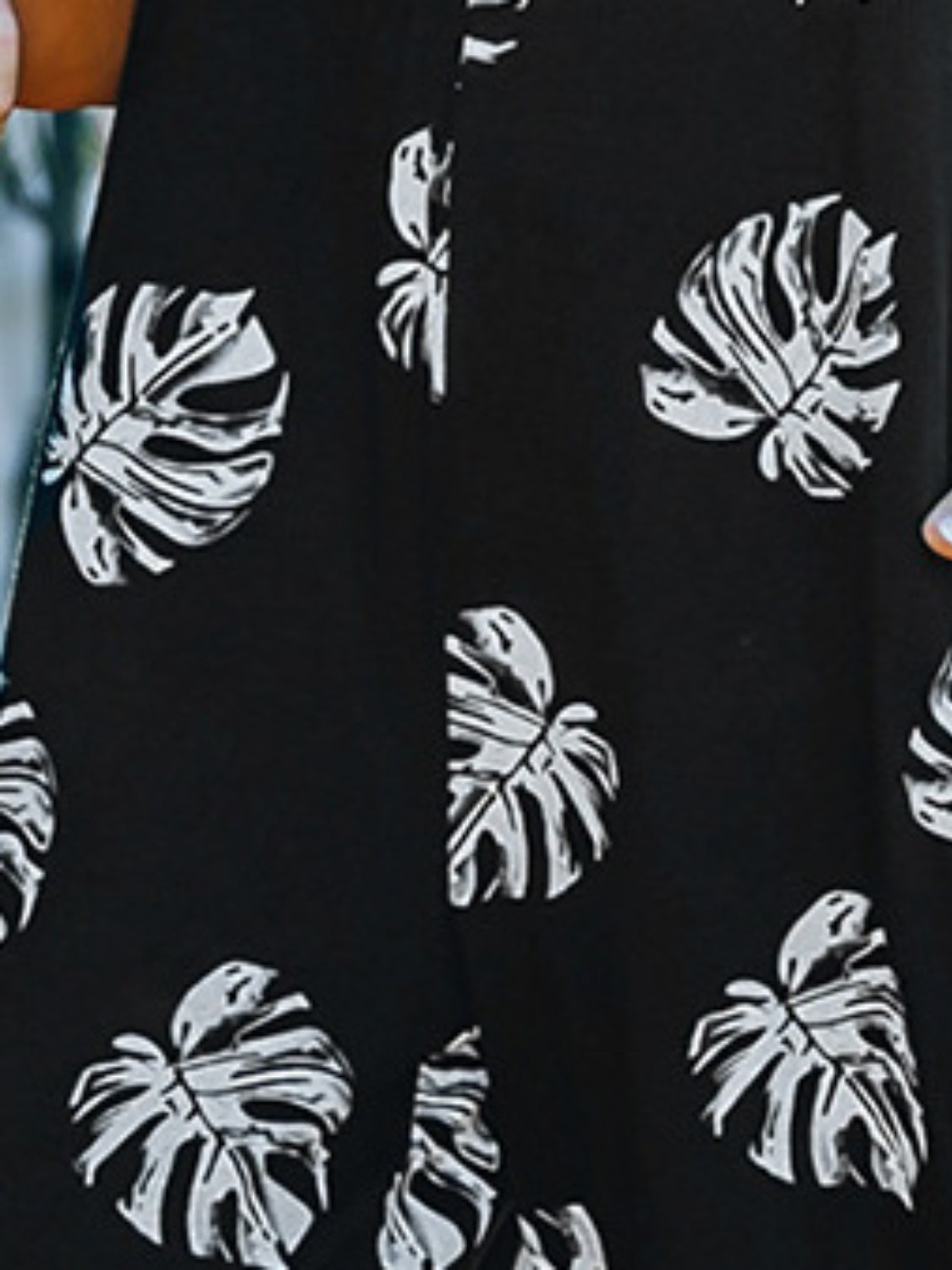 Printed Spaghetti Strap Jumpsuit with Pockets.