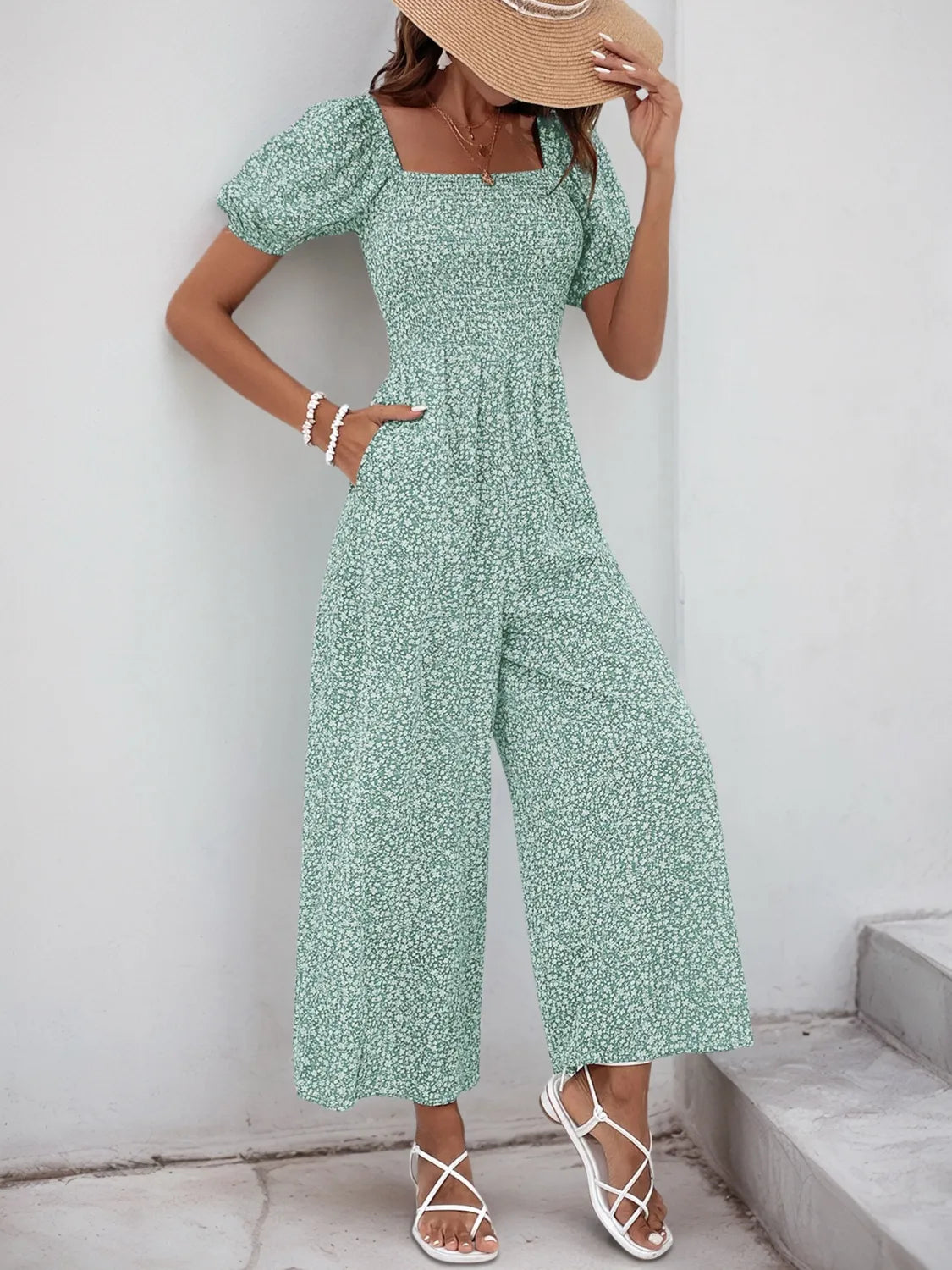 Printed Square Neck Puff Sleeve Jumpsuit with Smocked Detail and Pockets.