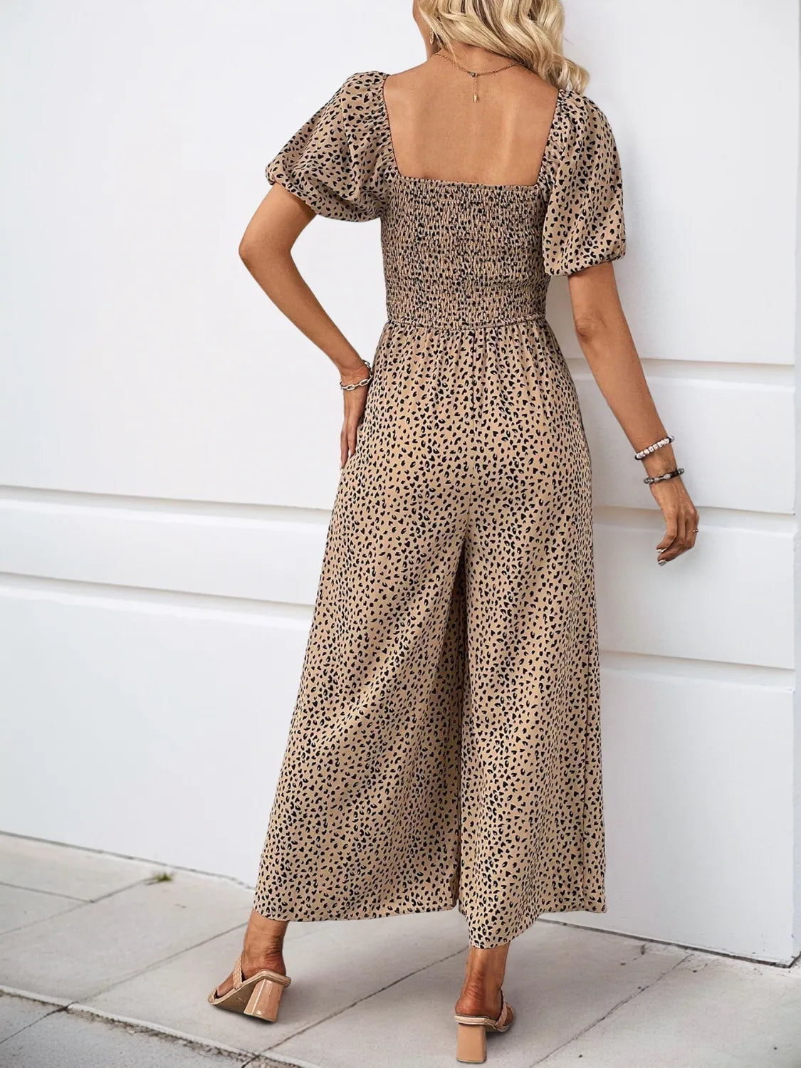 Printed Square Neck Puff Sleeve Jumpsuit with Smocked Detail and Pockets.
