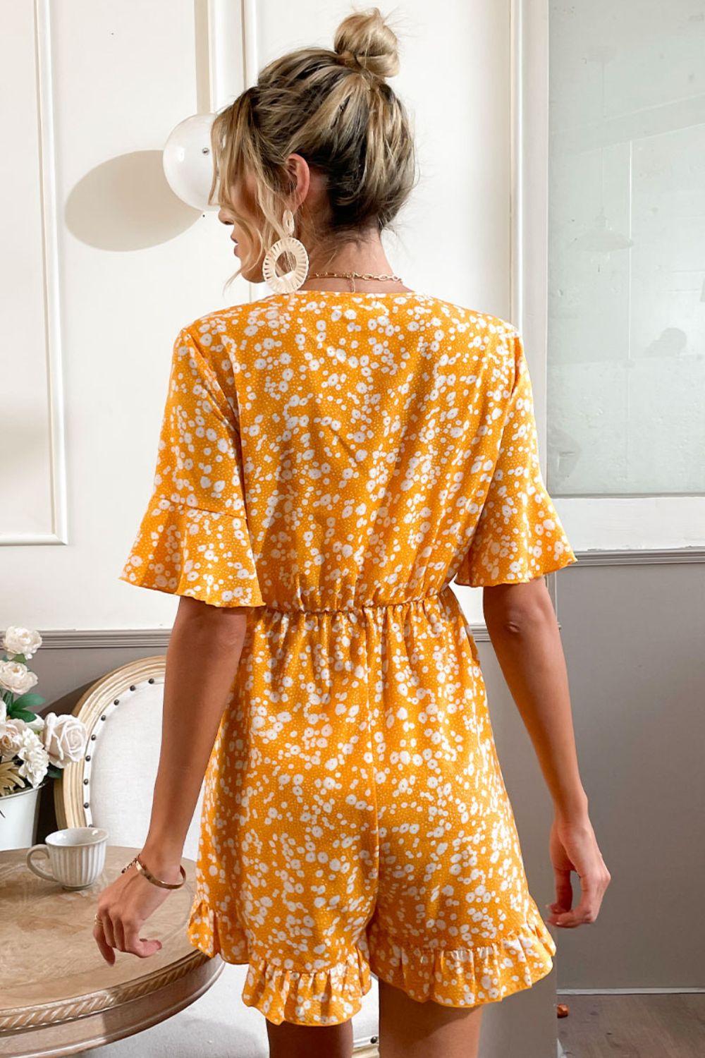 Printed Surplice Neck Ruffled Romper with Tie and Flounce Sleeves.