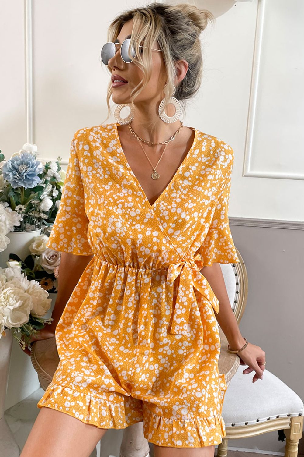 Printed Surplice Neck Ruffled Romper with Tie and Flounce Sleeves.