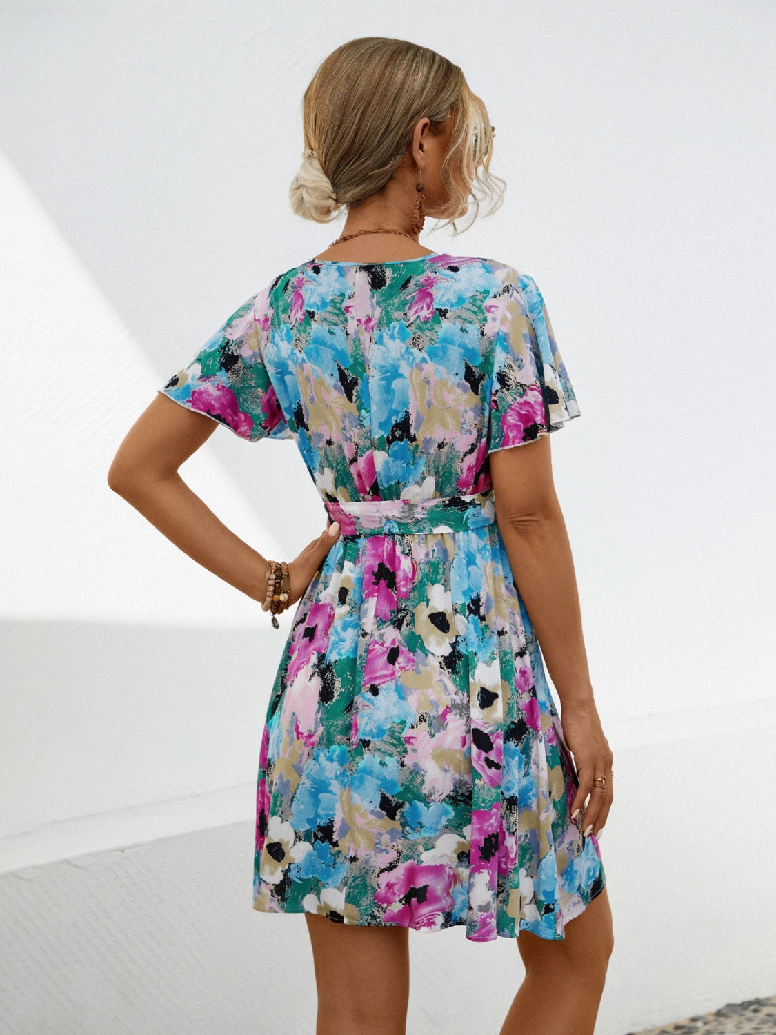 Printed Surplice Tie Waist Mini Dress.