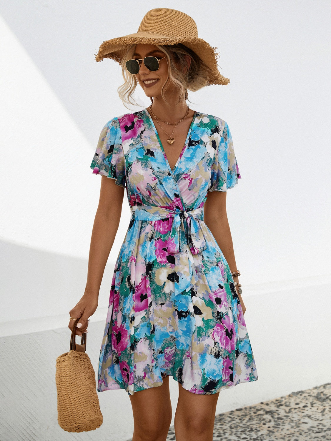 Printed Surplice Tie Waist Mini Dress.