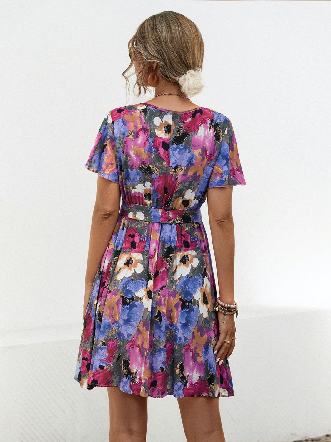 Printed Surplice Tie Waist Mini Dress.