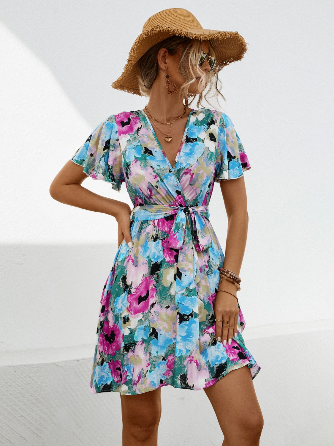 Printed Surplice Tie Waist Mini Dress.