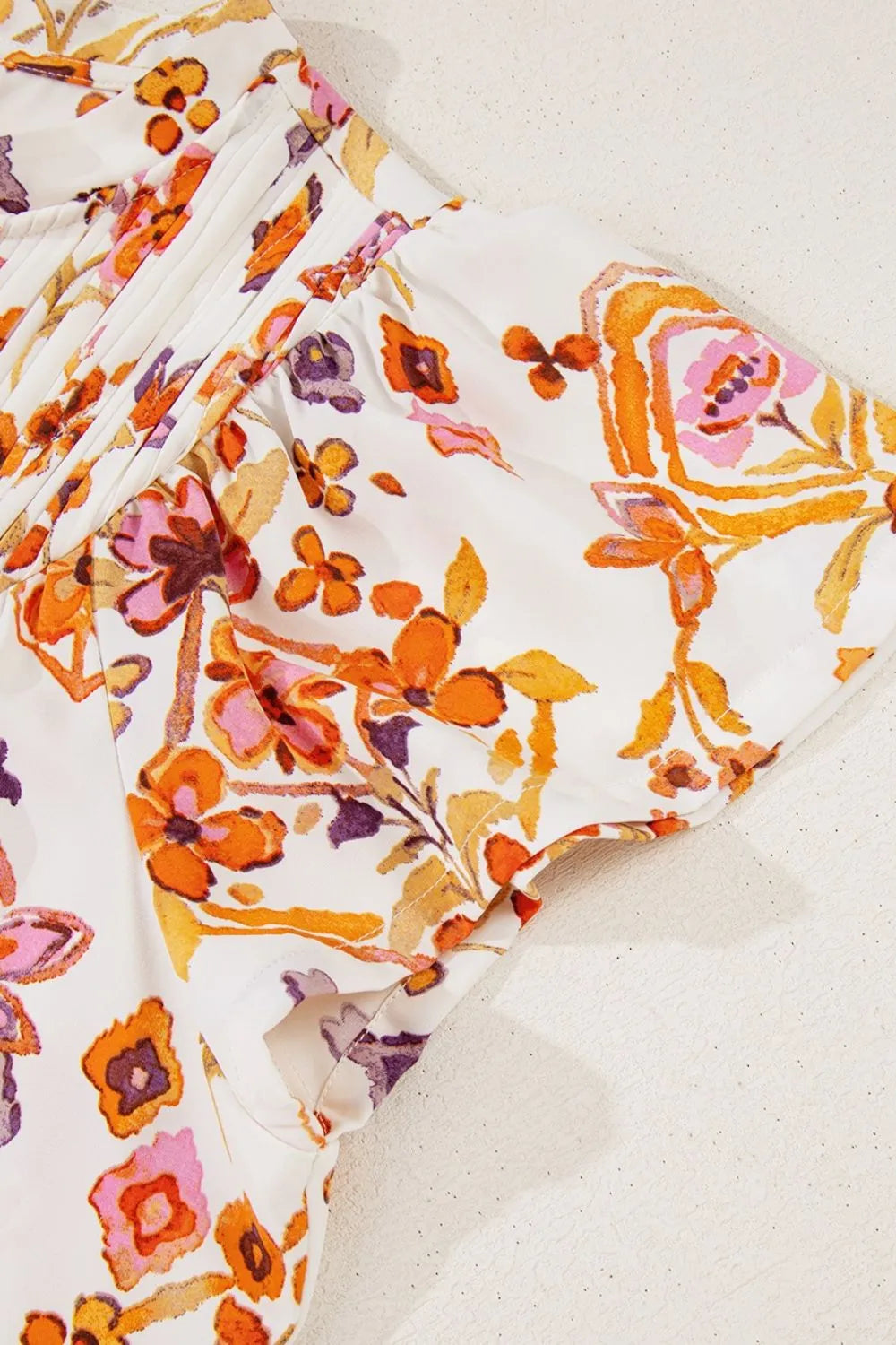 Printed Tie Neck Cap Sleeve Mini Dress.