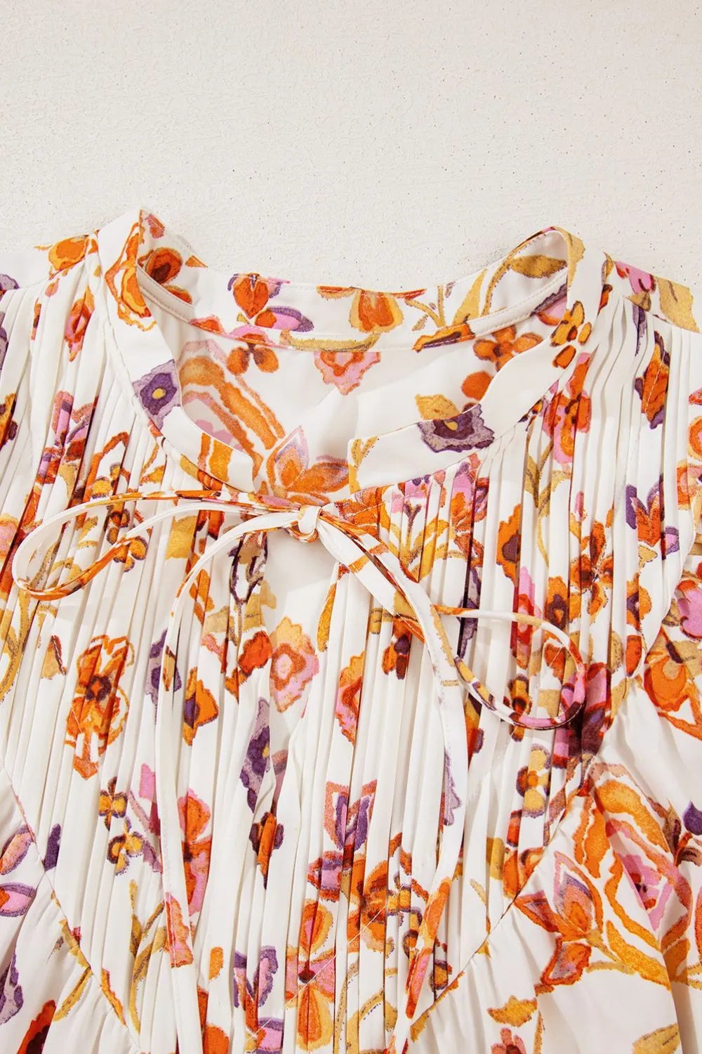Printed Tie Neck Cap Sleeve Mini Dress.