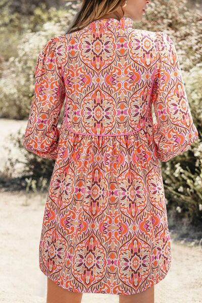 Printed Tie Neck Long Sleeve Mini Dress.