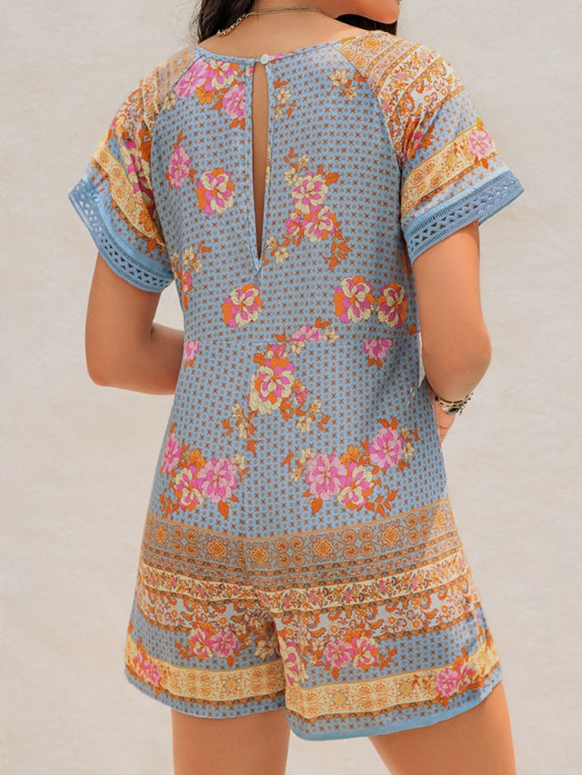 Printed V-Neck Short Sleeve Romper with Cutout.