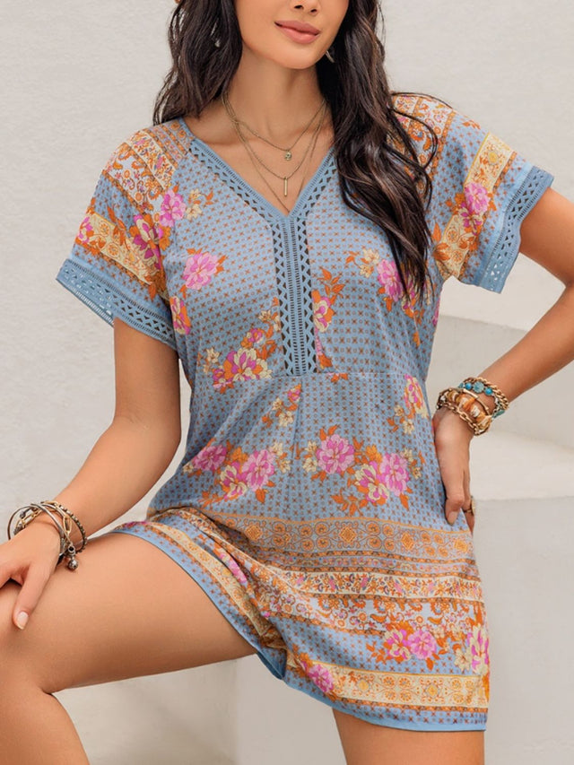 Printed V-Neck Short Sleeve Romper with Cutout.