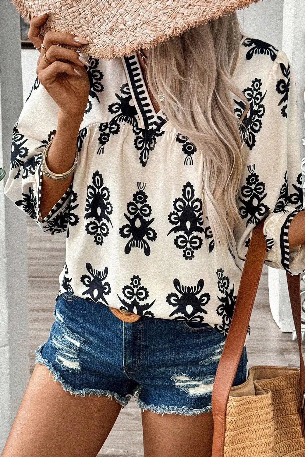 Printed V-Neck Three-Quarter Sleeve Blouse.