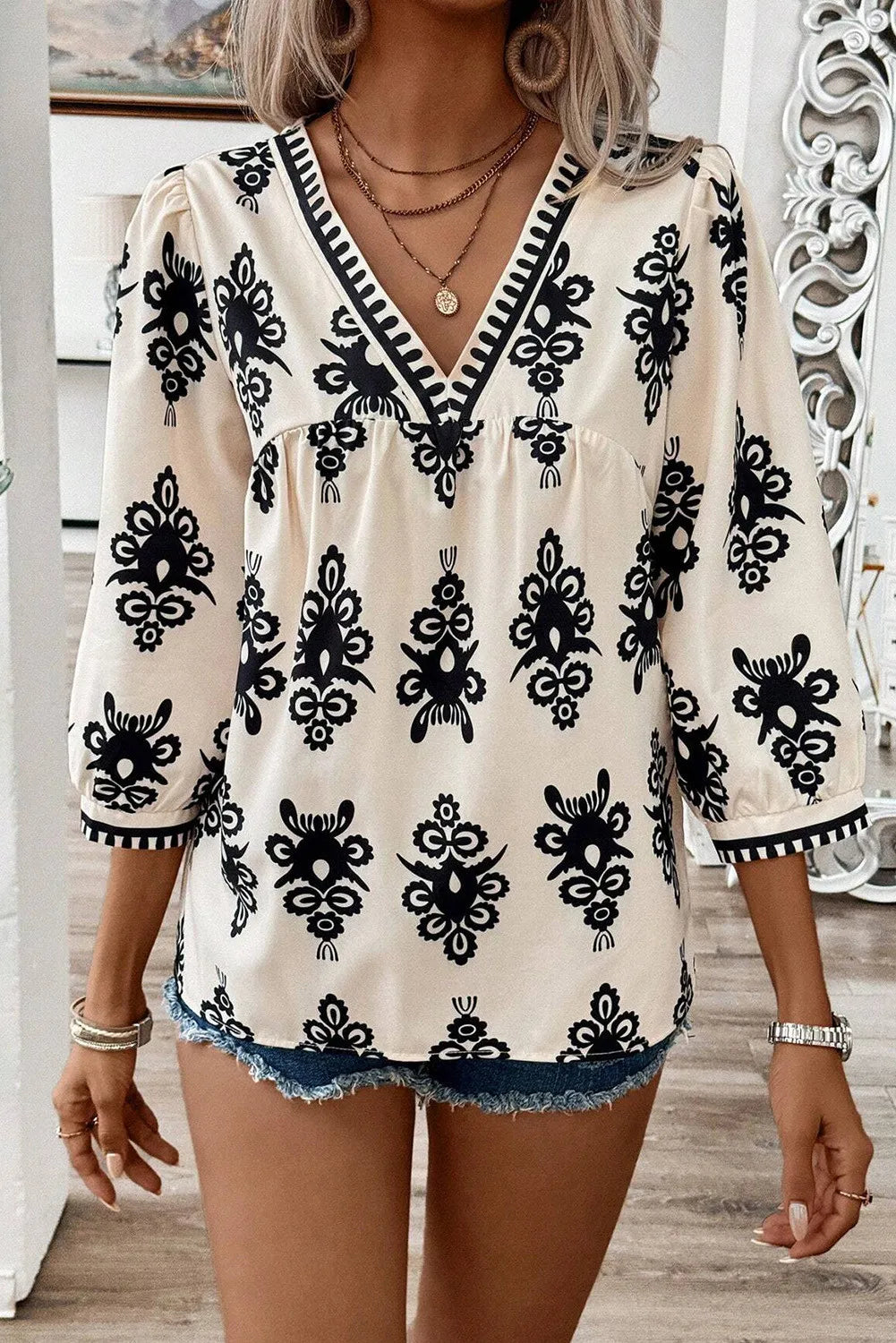 Printed V-Neck Three-Quarter Sleeve Blouse.