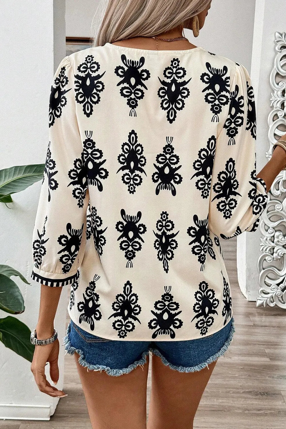 Printed V-Neck Three-Quarter Sleeve Blouse.