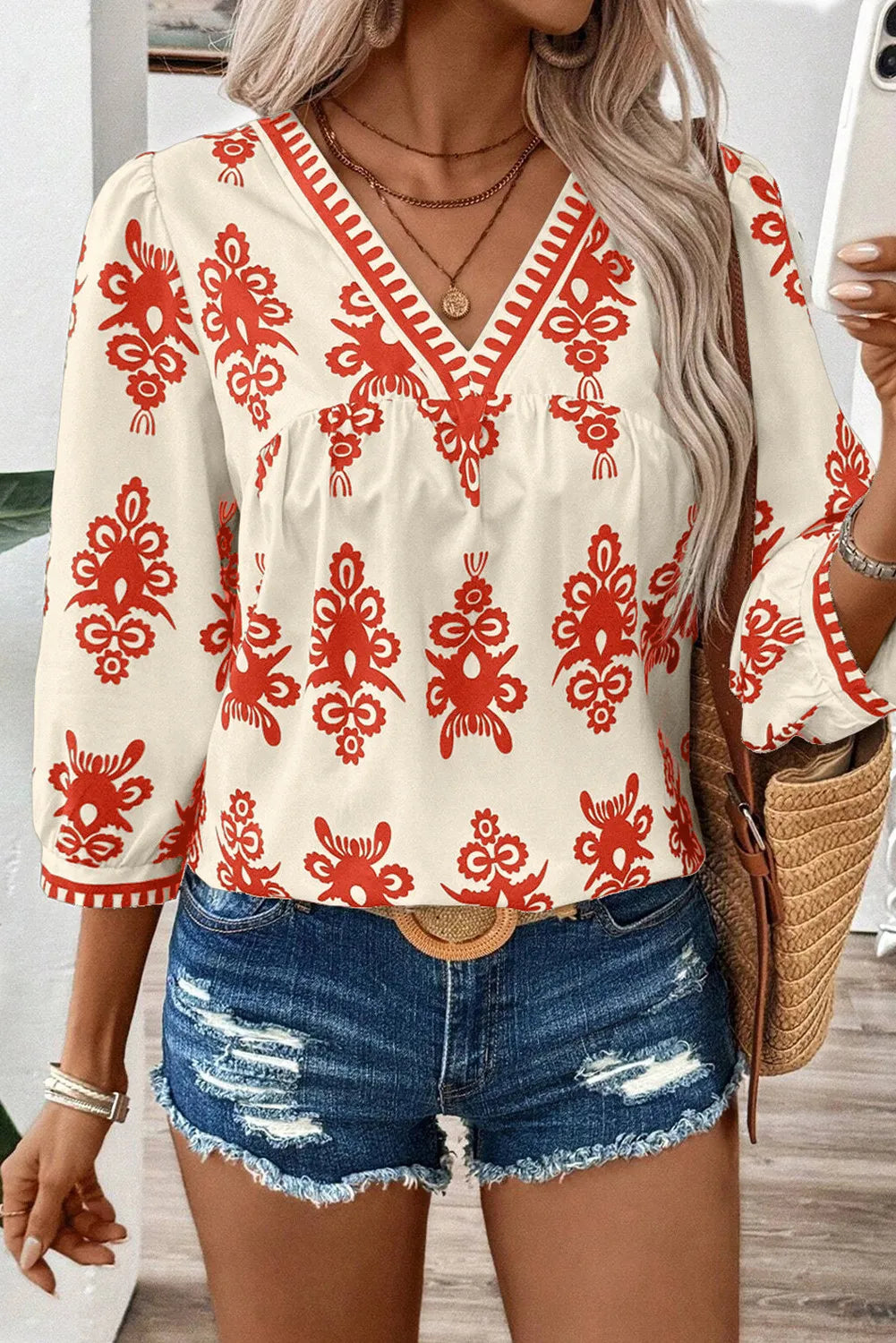 Printed V-Neck Three-Quarter Sleeve Blouse.