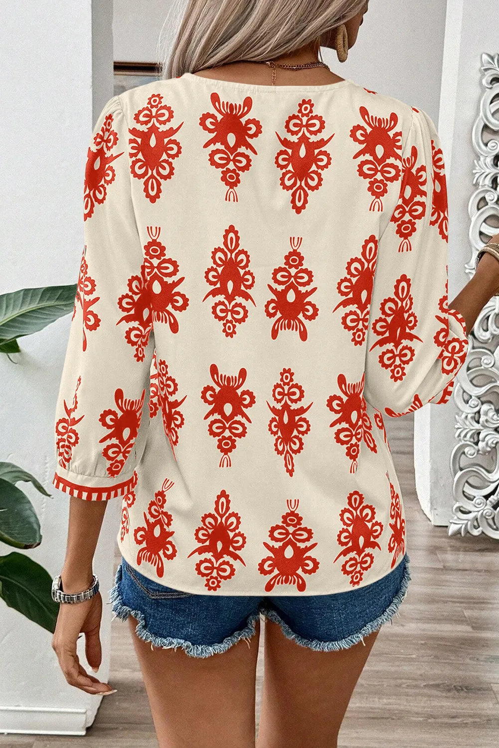 Printed V-Neck Three-Quarter Sleeve Blouse.