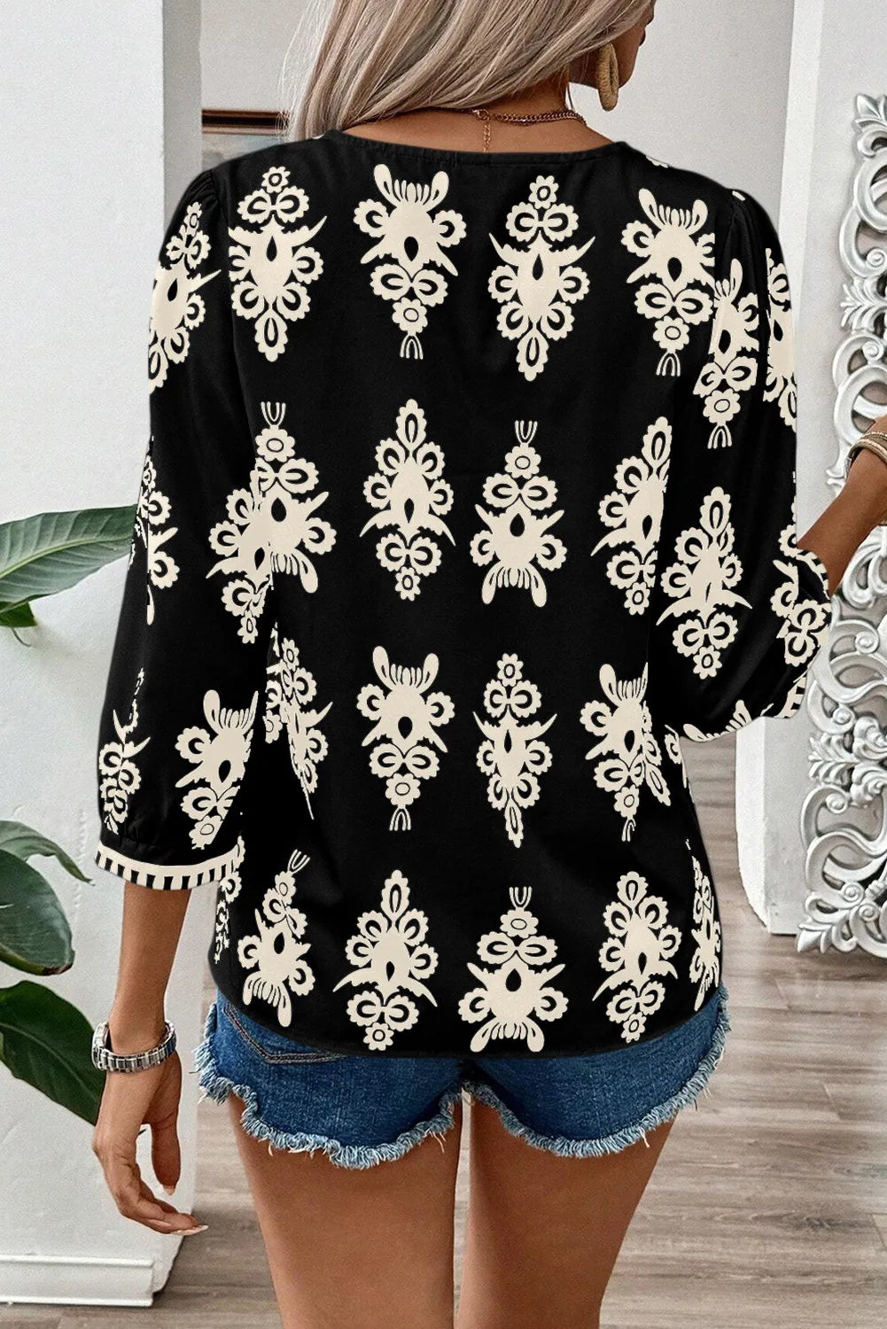 Printed V-Neck Three-Quarter Sleeve Blouse.