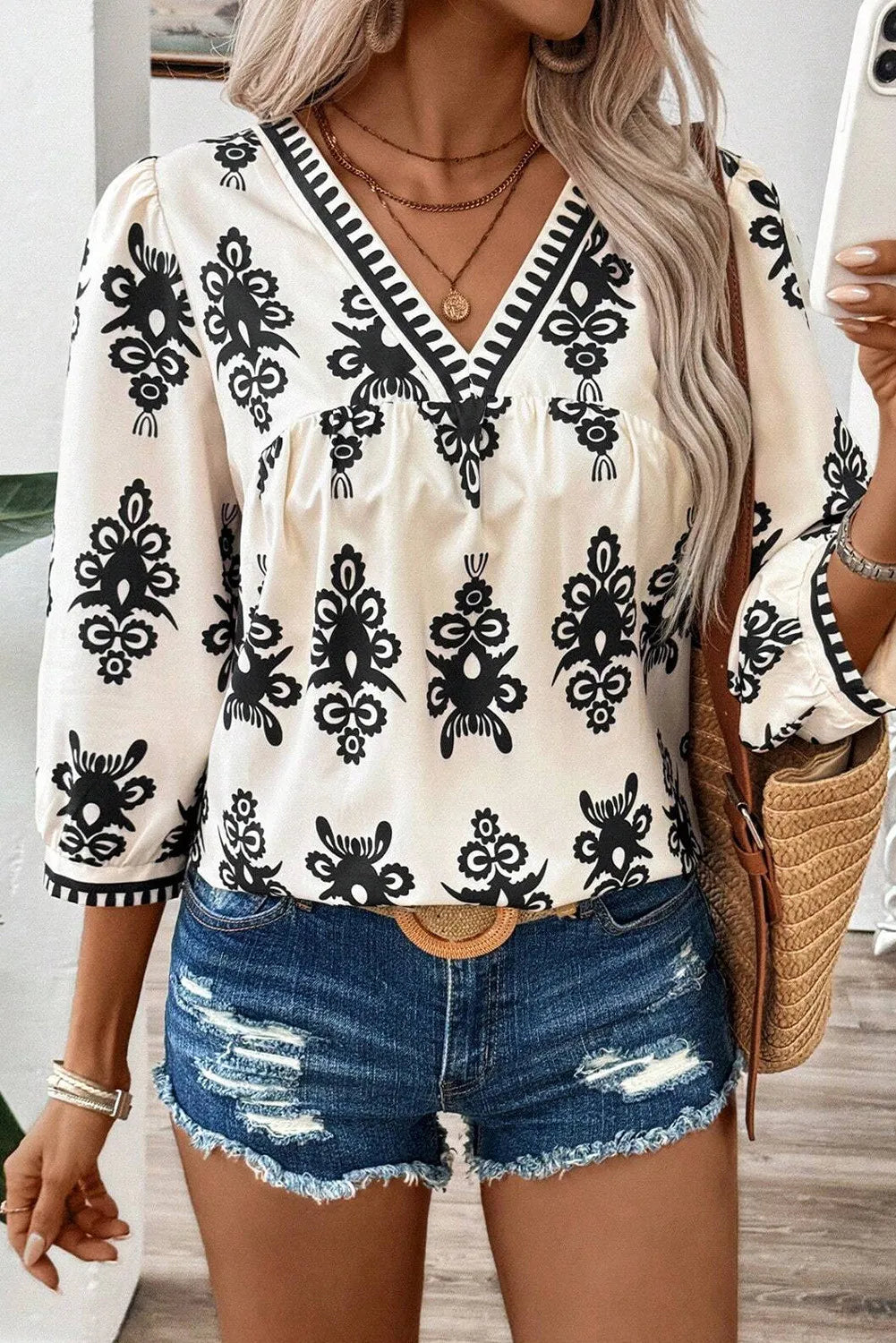 Printed V-Neck Three-Quarter Sleeve Blouse.
