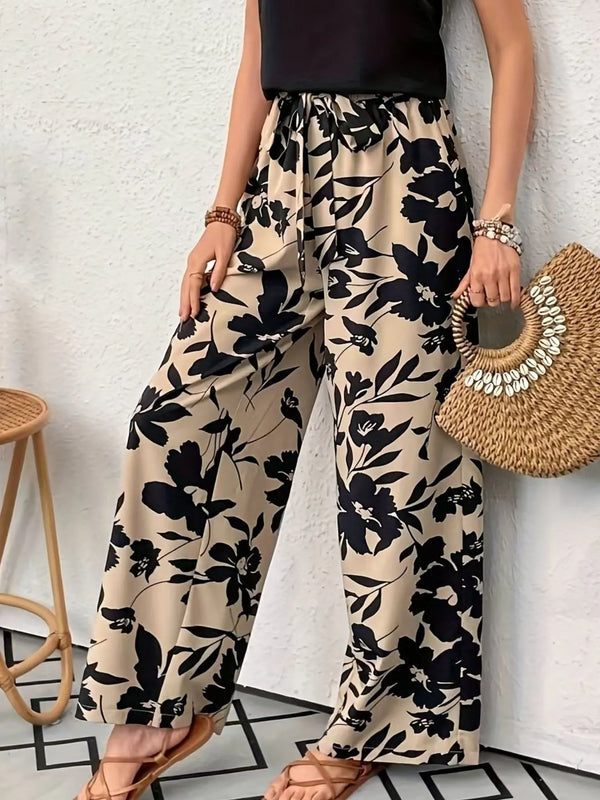 Printed wide leg casual pants with drawstring and pockets.