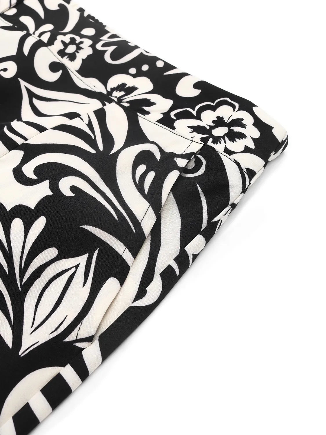 Printed wide leg pants with buttons and pockets.