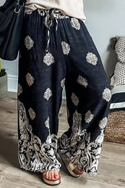 Printed wide leg pants with drawstring, opaque.