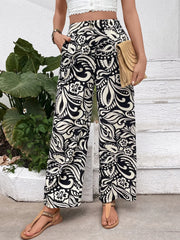 Printed wide leg pants with buttons and pockets.