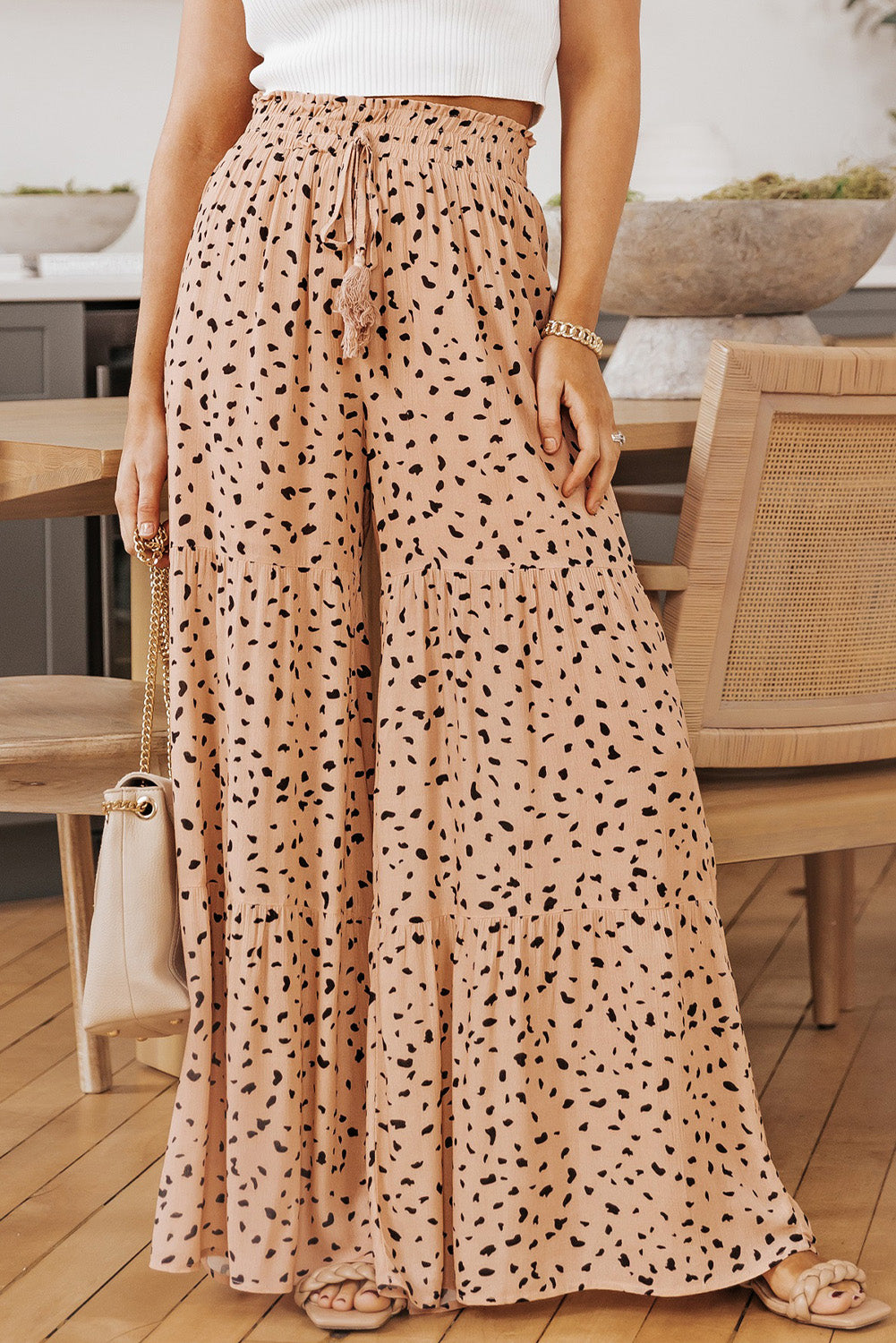 Printed wide tiered pants with drawstring, casual chic style.